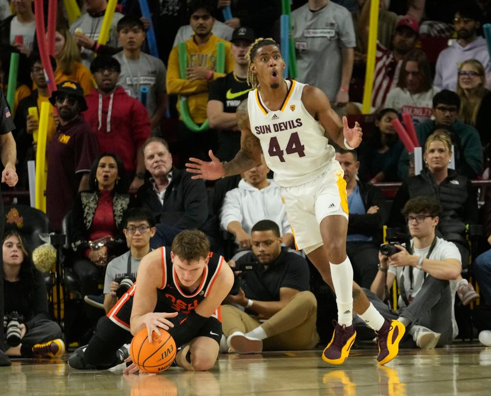 Arizona State guard Adam Miller (44) reacts to a foul called on him against Oregon State forward Tyler Bilodeau (34) during the second half at Desert Financial Arena in Tempe on Feb. 14, 2024.