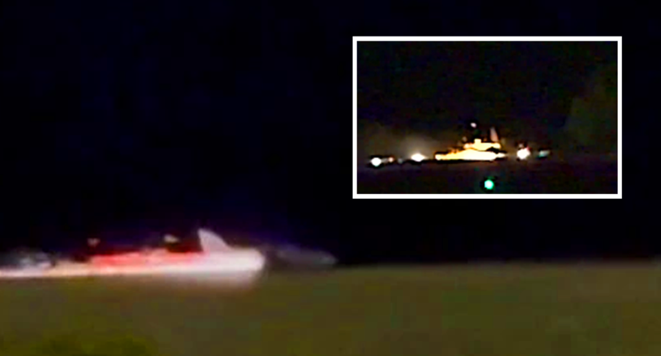 Sparks are seen flying from the aircraft that touched down at the Gold Coast without landing gear. 