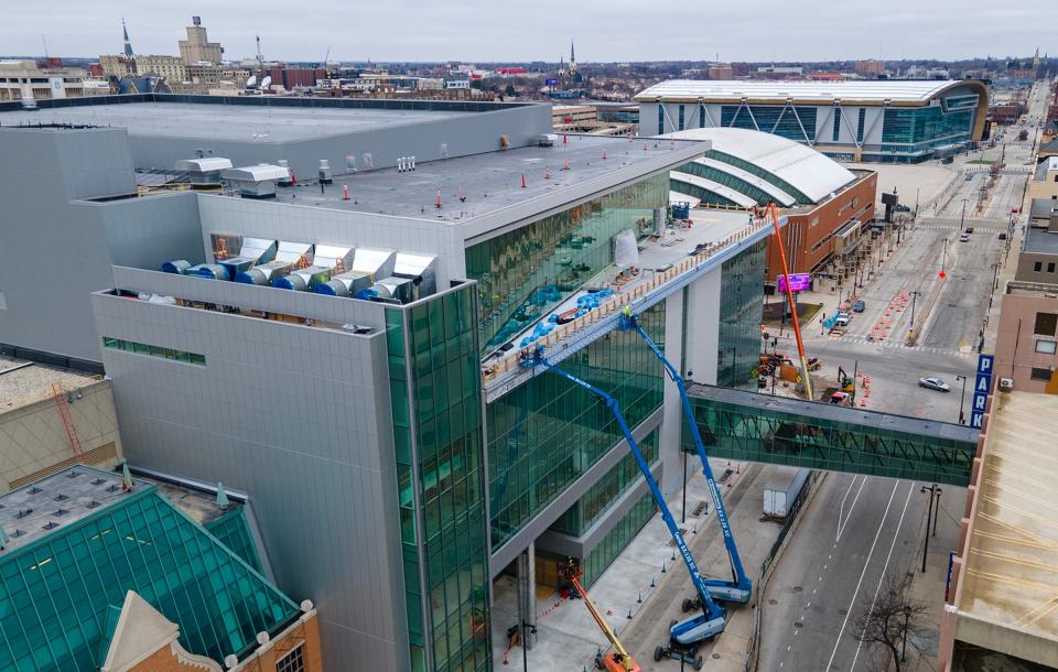 Work is done on the expansion of downtown Milwaukee's Baird Center (left) next to the UW-Milwaukee Panther Arena and Fiserv Forum (upper) in Milwaukee on Monday. The three facilities will be central to the 2024 Republican National Convention when it's held July 15-18.