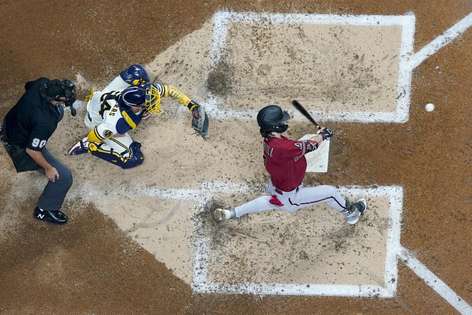 Arizona Diamondbacks' Corbin Carroll hits a two-run home run during the third inning of a Game 1 of their National League wildcard baseball game against the Milwaukee Brewers Tuesday, Oct. 3, 2023, in Milwaukee. (AP Photo/Morry Gash)