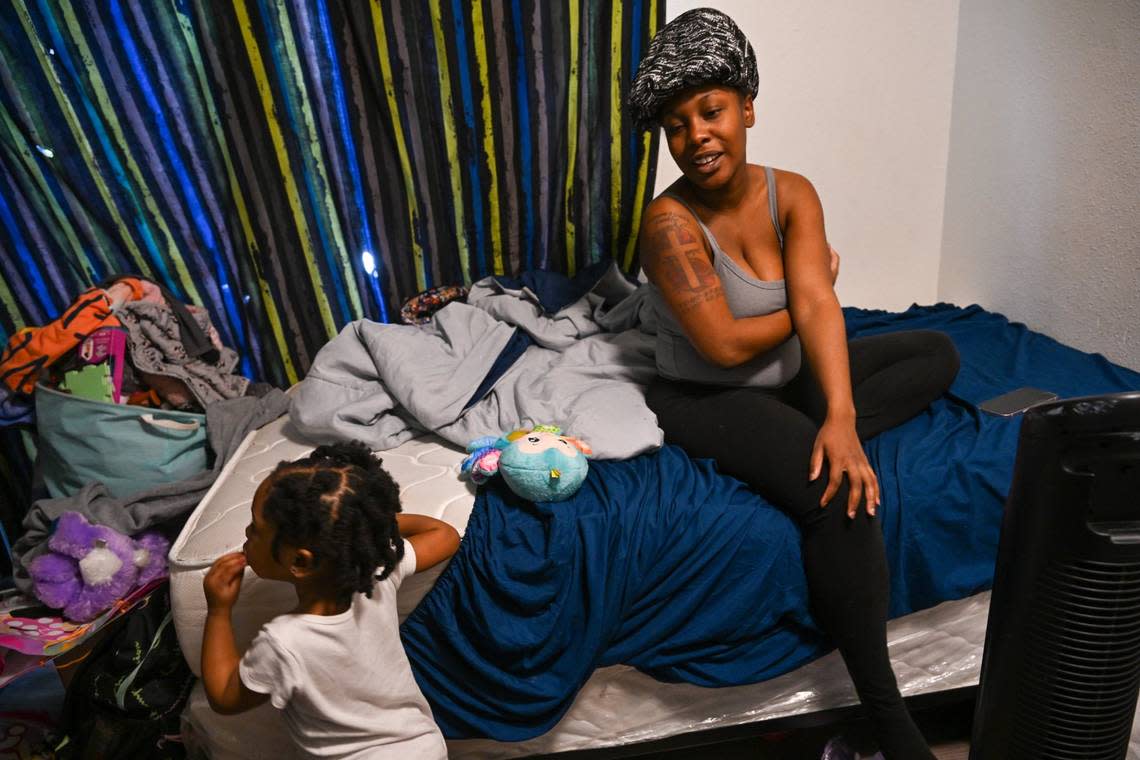 Dejanae Franklin, who is pregnant, looks over at her daughter Faith Marshall, 2, in March while staying in the room of uncle Carlton Franklin after being homeless. Carlton took his niece in to try and help her, even though he was on the verge of eviction. She said she called 211 several times to try and get housed but no one responded.