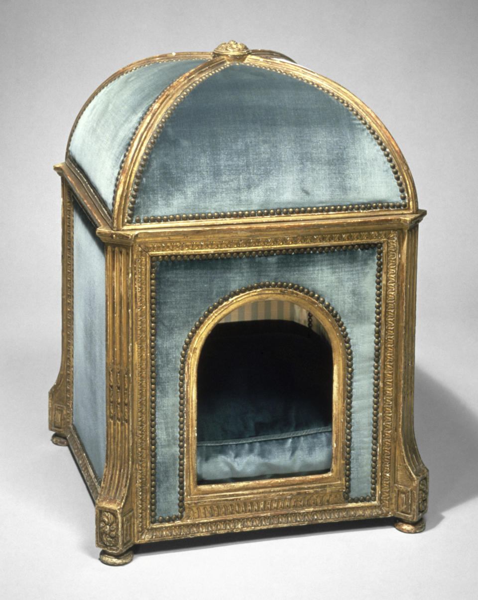 This photo provided by The Metropolitan Museum of Art shows a dog kennel made by Claude I Sené (French, 1724–1792), circa 1775–80. The kennel is made of gilded beech and pine; silk and velvet. The kennel once belonged to Marie Antoinette. No longer are furniture companies content to offer you staples like a sofa, easy chair and bed. Now they have those items for your pet, too, designed not to clash with the rest of your decor. Pottery Barn, Crate and Barrel, Ikea, Casper mattresses and other popular furniture purveyors have lines for pets, often in styles that complement their human-size living room furniture.(Metropolitan Museum of Art via AP)