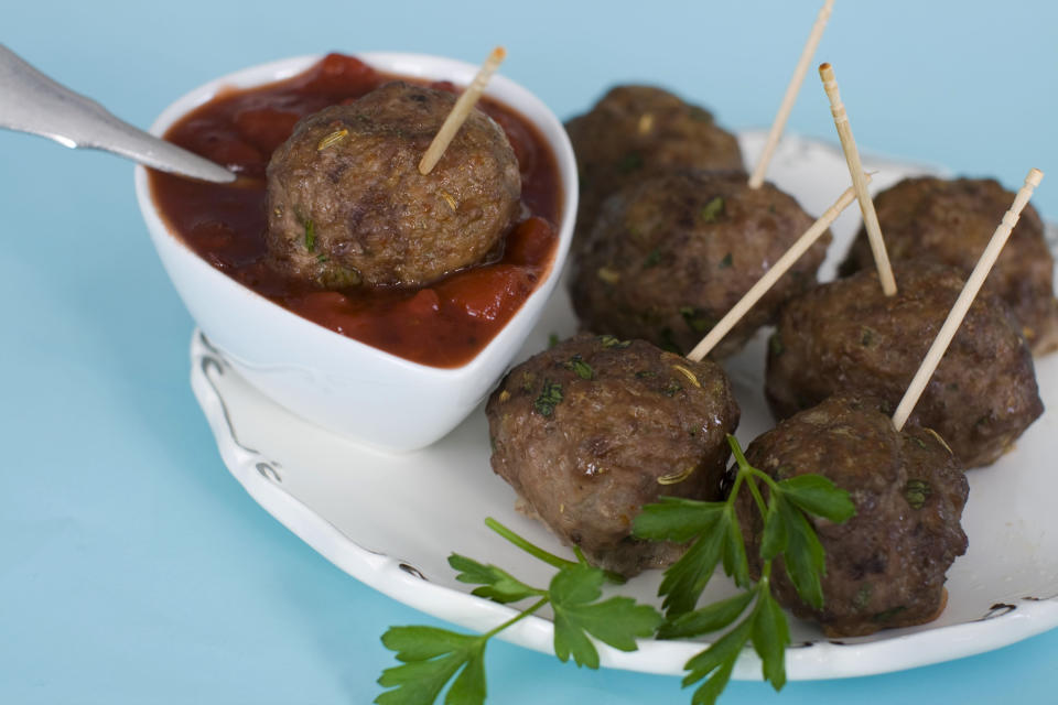 n this image taken on Monday, Nov. 26, 2012, cocktail meatballs with cranberry marinara are shown served on a platter in Concord, N.H. (AP Photo/Matthew Mead)