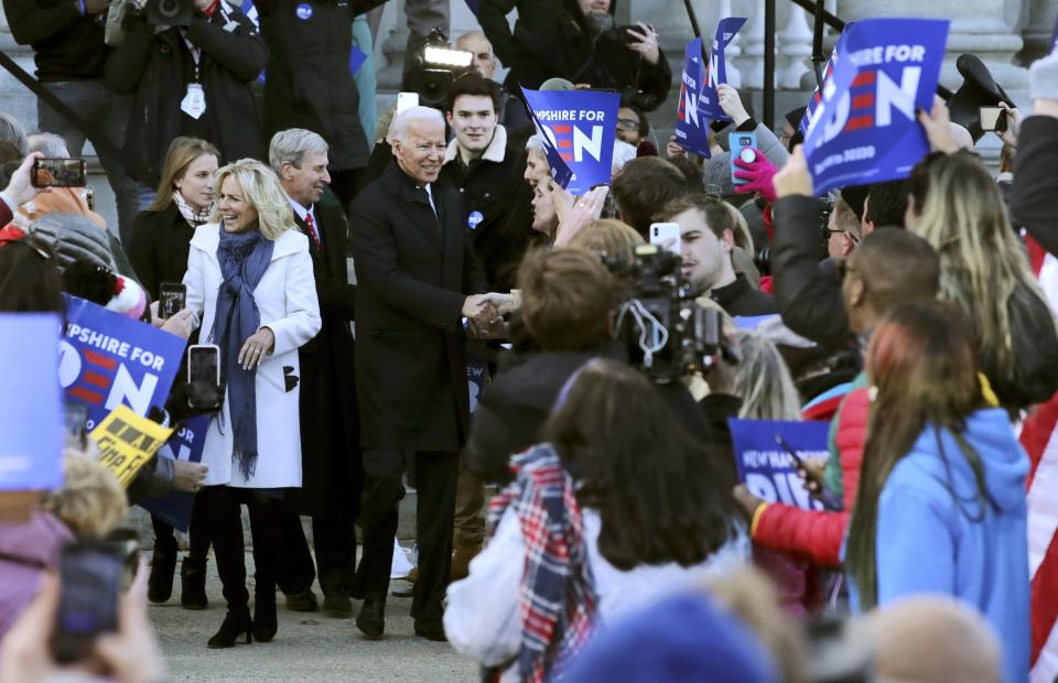 Democratic presidential candidate former Vice President Joe Biden, center, and wife Jill Biden at his side, greet supporters outside the New Hampshire State House after he filed to have his name listed on the New Hampshire primary ballot, Friday, Nov. 8, 2019, in Concord, N.H. (AP Photo/Charles Krupa)