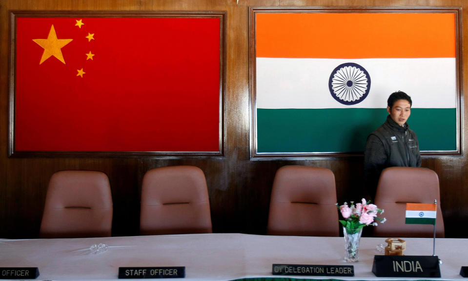 Image: A man walks inside a conference room used for meetings between military commanders of China and India, at the Indian side of the Indo-China border at Bumla, in the northeastern Indian state of Arunachal Pradesh. (Adnan Abidi / Reuters file)