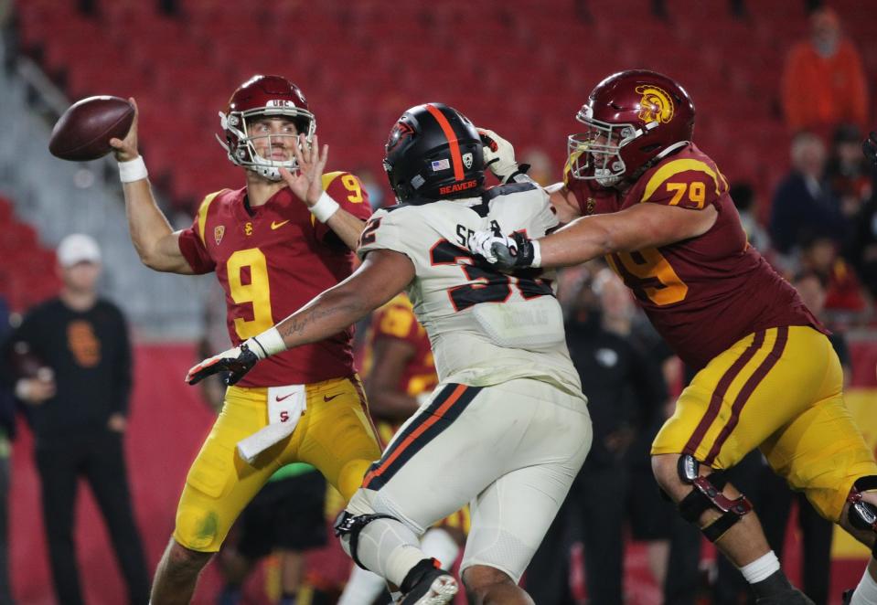 USC offensive lineman Jonah Monheim, right, tries to block Oregon State defensive lineman Keonte Schad.