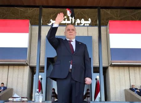 Iraqi Prime Minister Haider al-Abadi attends during an Iraqi military parade in Baghdad, Iraq, December 10, 2017. Iraqi Prime Minister Media Office/Handout via REUTERS