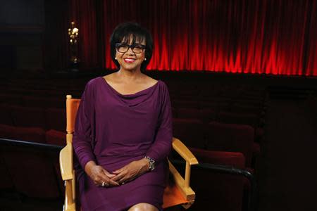 Academy President Cheryl Boone Isaacs poses for a portrait inside the The Samuel Goldwyn theatre at the Academy of Motion Picture Arts and Sciences in Beverly Hills, California February 19, 2014. REUTERS/Mario Anzuoni