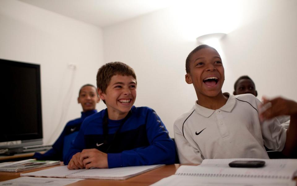 Kylian Mbappe with Sergio Goncalves at the football academy of Clairefontaine - Magali Delporte/Eyevine