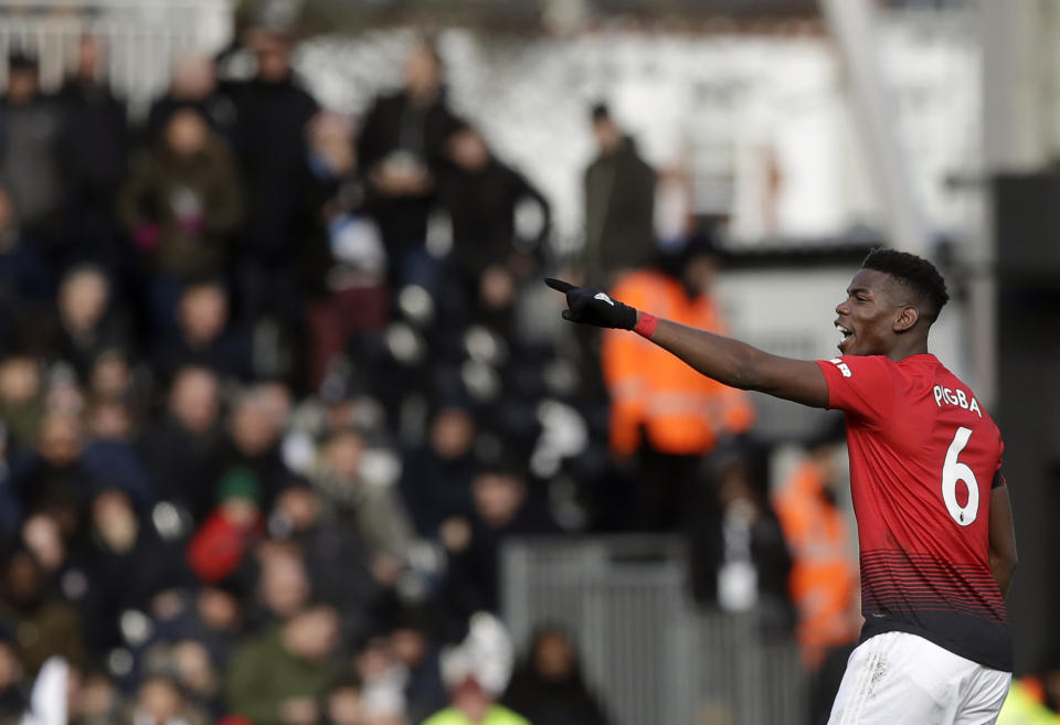 Manchester United's Paul Pogba celebrates after scoring his side's opening goal during the English Premier League soccer match between Fulham and Manchester United at Craven Cottage stadium in London, Saturday, Feb. 9, 2019. (AP Photo/Matt Dunham)