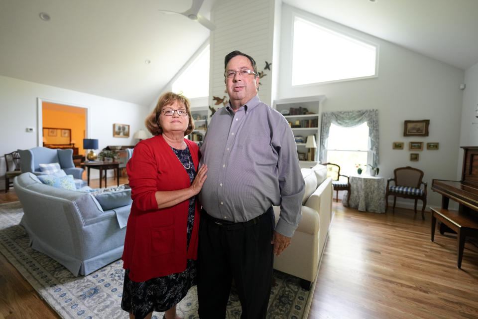 Gene and Sallie Carr pose for a picture in their recently remodeled home on Tuesday, May 7, 2024, in Hendersonville, N.C. An increasing number of Americans in their late 50s and older are staying in their houses, some by choice, others because they're locked into low mortgage rates that are too low to give up. (AP Photo/Chris Carlson)