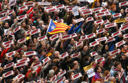 Protesters hold banners reading "Freedom Political Prisoners, We are Republic" as they gather in Sant Jaume square at a demonstration during a partial regional strike in Barcelona, Spain, November 8, 2017. REUTERS/Albert Gea