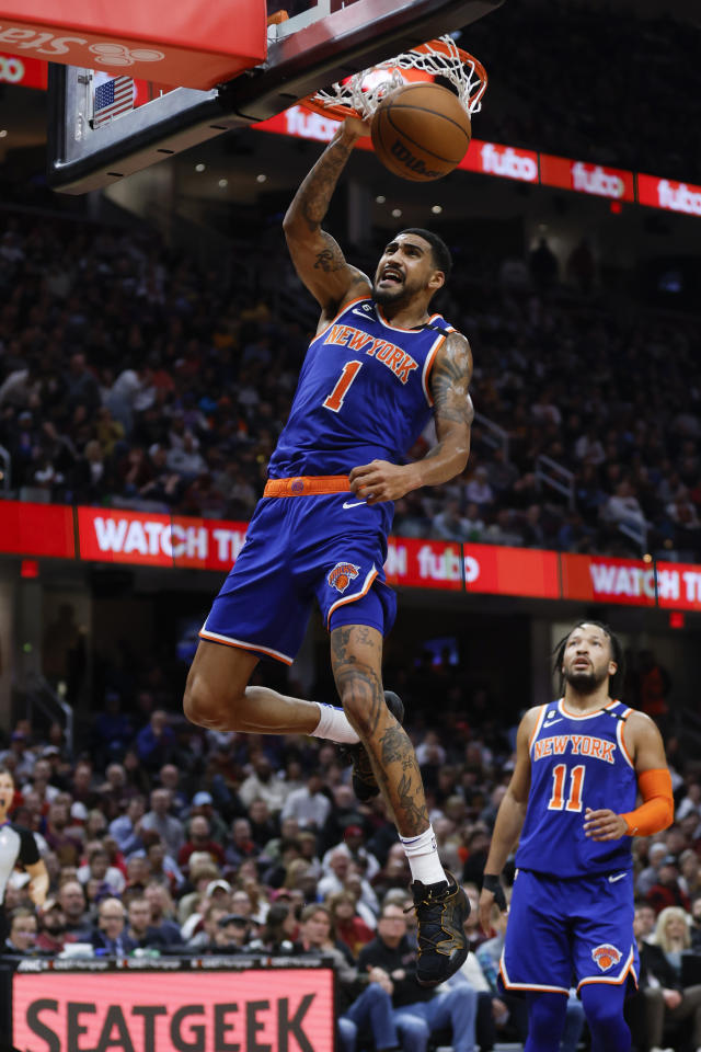 New York Knicks forward Obi Toppin (1) dunks against the Cleveland Cavaliers during the second half of an NBA basketball game, Friday, March 31, 2023, in Cleveland. (AP Photo/Ron Schwane)