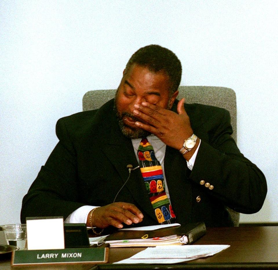 Former Columbus School Superintendent Larry Mixon wipes away a tear after telling the school board he would not continue after his contract runs out on July 31, 1997.
(Credit: Dispatch file photo)