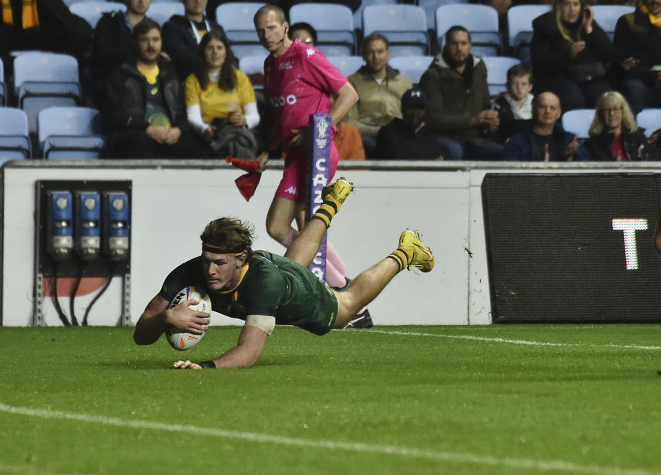 Australia's Campbell Graham scores a try during the Rugby League World Cup match between Australia and Scotland at Coventry Building Society Arena, Coventry, England, Friday, Oct. 21, 2022. (AP Photo/Rui Vieira)