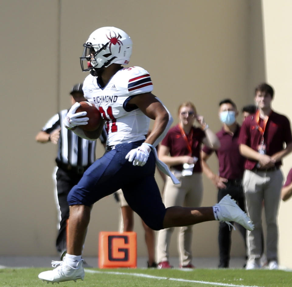 Richmond's Savon Smith (31) scores a 16 yard touchdown in the first half of the Richmond Virginia Tech NCAA college football game in Blacksburg, Va., Saturday, Sept. 25 2021. (Matt Gentry/The Roanoke Times via AP)