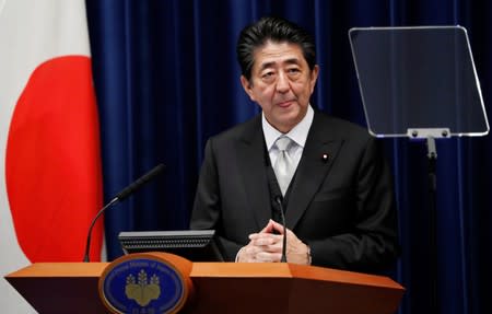 Japan's Prime Minister Shinzo Abe speaks at a news conference after reshuffling his cabinet at his official residence in Tokyo