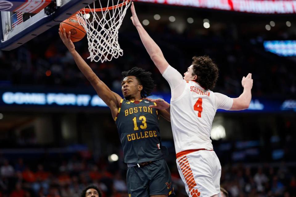 Mar 13, 2024; Washington, D.C., USA;Boston College Eagles guard Donald Hand Jr. (13) shoots the ball as Clemson Tigers forward Ian Schieffelin (4) defends in the first half at Capital One Arena. Mandatory Credit: Geoff Burke-USA TODAY Sports