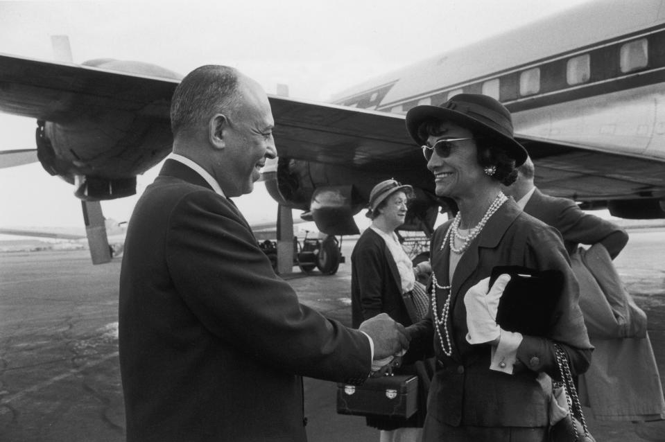 Stanley Marcus says goodbye to Coco Chanel at the airport, after her visit to the Neiman Marcus store in Dallas, 1957.