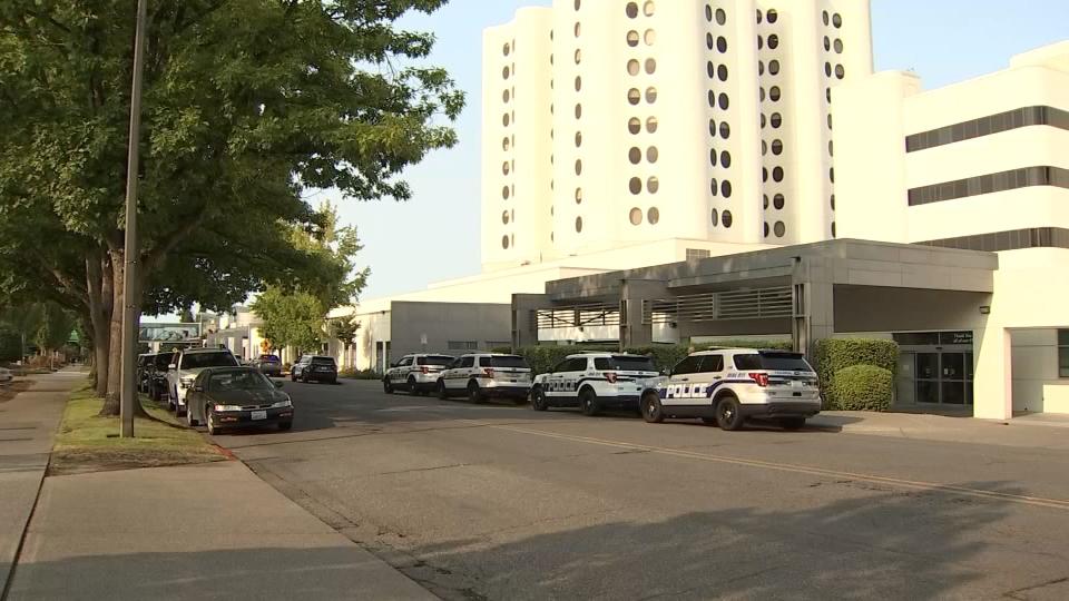 Tacoma officers outside St. Joseph Medical Center in Tacoma, where the injured detective was taken.