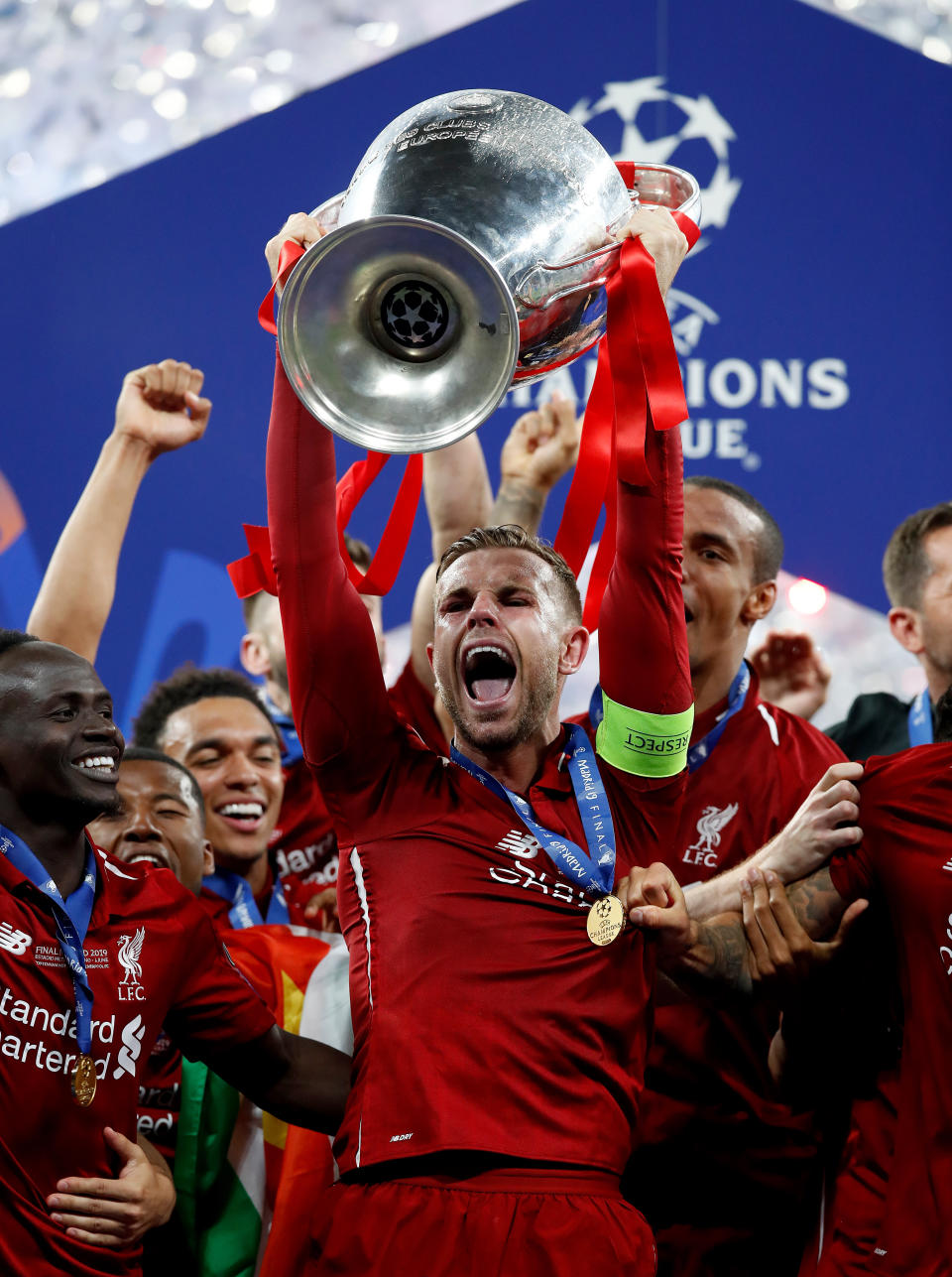 Liverpool's Jordan Henderson celebrates with the trophy during the UEFA Champions League Final at the Wanda Metropolitano, Madrid.