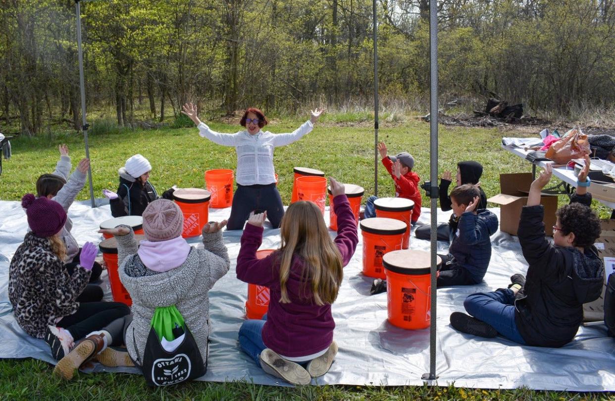 Bo Lebo, the inventor of Musical Linguistics, leads a group of Immaculate Conception School students in a musical exercise during the Earth Heart Farms Spring Festival at Troop 316 Scout Farm on April 26.