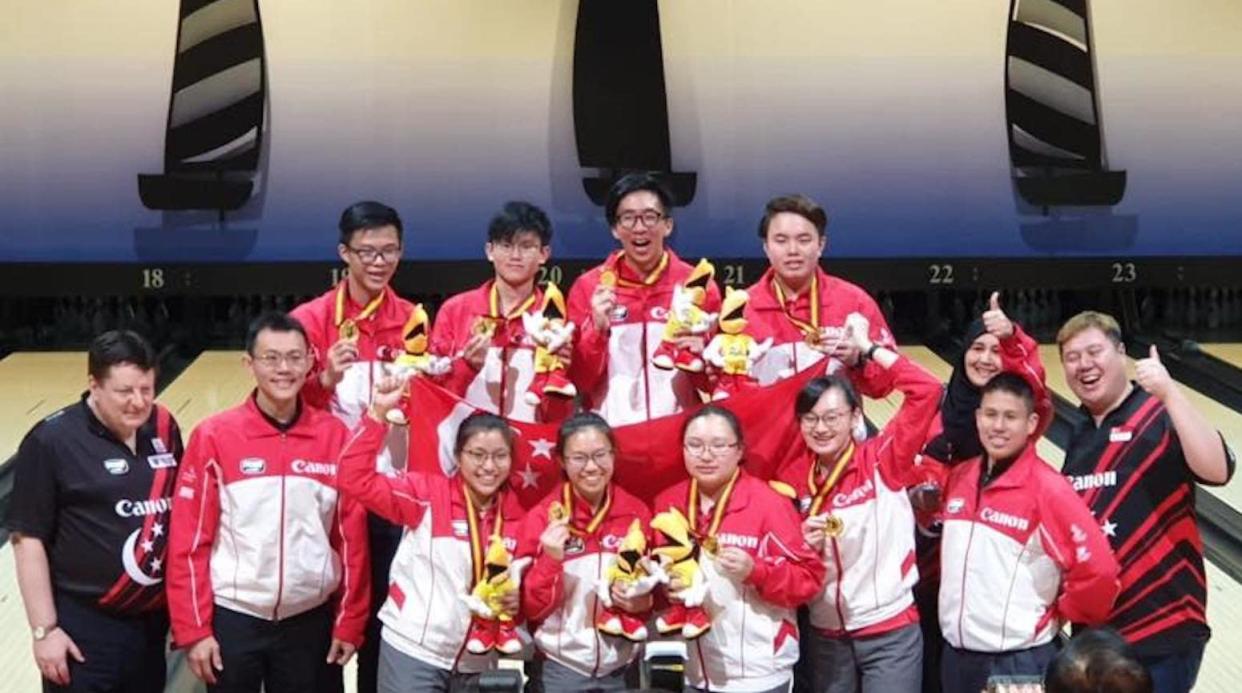 The victorious Singapore boys' and girls' teams with their coaches at the Asian Youth Tenpin Bowling Championships in Kuching. (PHOTO: Singapore Bowling Federation/Facebook)