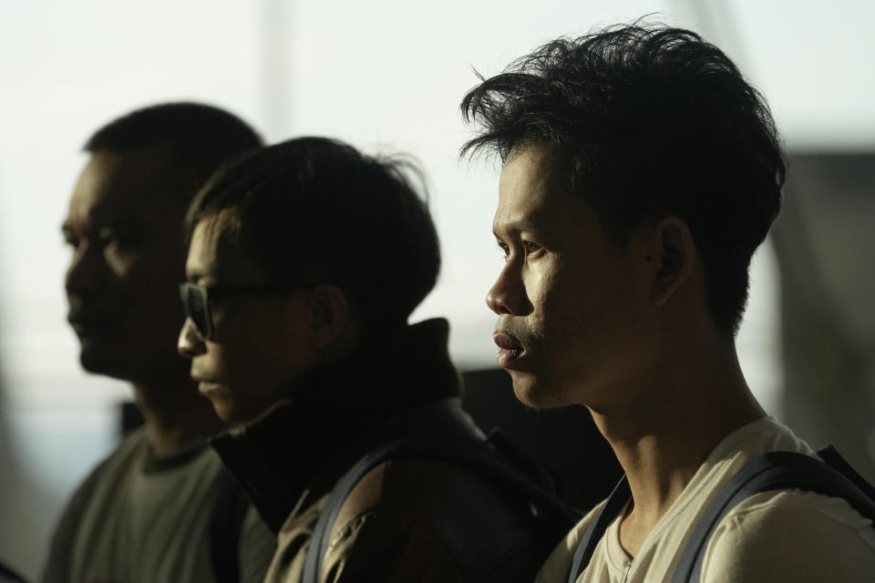 Thai hostages who were freed from Hamas observe a minute of silence upon their arrival at Suvarnabhumi International Airport in Samut Prakarn Province, Thailand, Thursday, Nov. 30, 2023. Twenty-three Thai hostages kidnapped by Hamas in its Oct. 7, 2023 attack on southern Israel have been freed so far, and Thailand's foreign ministry says nine remain in captivity in Gaza. There were about 30,000 Thai overseas workers in Israel, mostly in the agricultural sector, but more than 8,000 have returned home since the attack. (AP Photo/Sakchai Lalit)