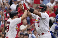 St. Louis Cardinals' Albert Pujols (5) is congratulated by teammate Tommy Edman after hitting a two-run home run during the eighth inning of a baseball game against the Chicago Cubs Sunday, Sept. 4, 2022, in St. Louis. (AP Photo/Jeff Roberson)