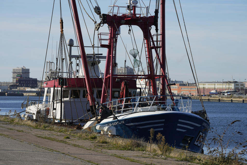 The British trawler kept by French authorities docks at the port in Le Havre, western France, Thursday, Oct. 28, 2021. French authorities fined two British fishing vessels and kept one in port overnight Thursday Oct.28, 2021 amid a worsening dispute over fishing licenses that has stoked tensions following the U.K.'s departure from the European Union. (AP Photo/Michel Euler)