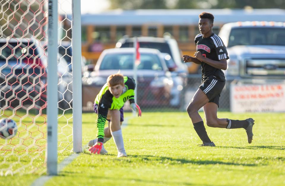 Springfield's Byron McNeil (30) sends a shot past Taylorville's Kole Buckley (00) for a goal in the first half during the Class 2A Regional Semifinals at Jacksonville High School  in Jacksonville, Ill., Tuesday, October 19, 2021. [Justin L. Fowler/The State Journal-Register] 