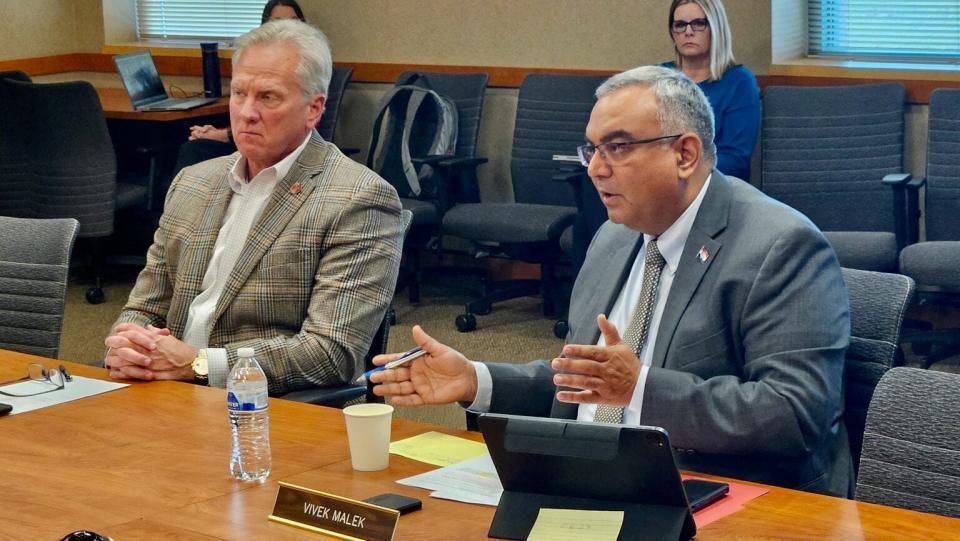 State Treasurer Vivek Malek, right, argues for removing Missouri State Employees Retirement System money from investments in Chinese businesses. Commissioner of Administration Ken Zellers is on his left.