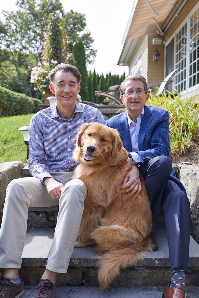 Donato Tramuto and Jeffrey Porter with their dog.