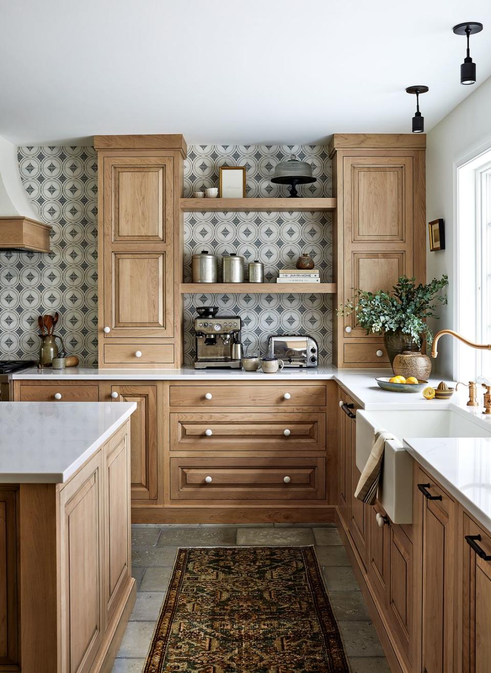 a kitchen with wooden cabinets