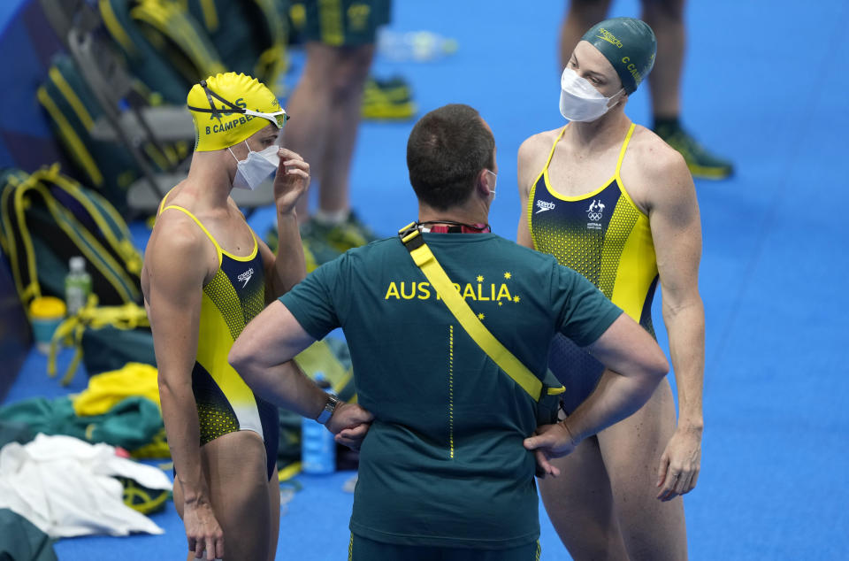 Australia swimmers Bronte Campbell, left, and Cate Campbell waiting to exercise during a swimming training session at the Tokyo Aquatics Centre at the 2020 Summer Olympics, Wednesday, July 21, 2021, in Tokyo, Japan. (AP Photo/Martin Meissner)