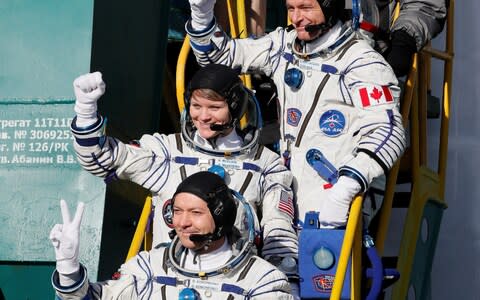 The International Space Station (ISS) crew members David Saint-Jacques of Canada, Oleg Kononenko of Russia and Anne McClain of the U.S. board the Soyuz MS-11 spacecraft  - Credit: REUTERS/Shamil Zhumatov