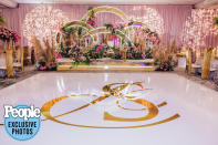 <p>The Friday night scene was stunning, with brightly colored flowers and the same gold accents seen Saturday. </p>