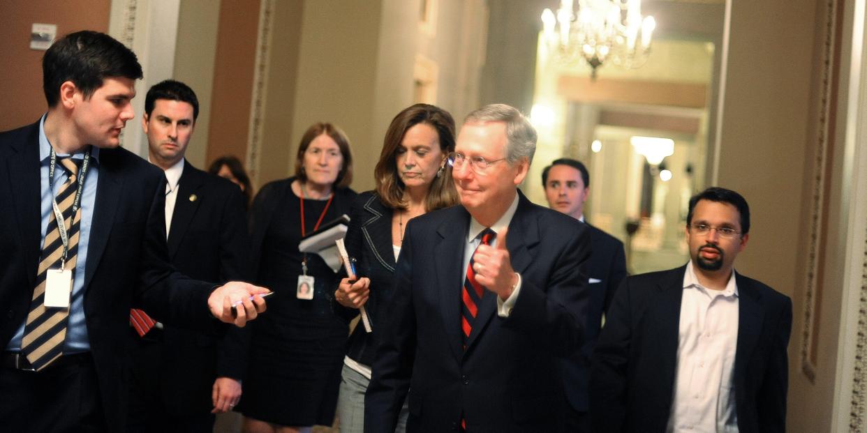 U.S. Senate Minority Leader Sen. Mitch McConnell (R-KY) gives a thumbs up when asked whether a deal has been reached regarding the ongoing debate on the national debt reduction on July 31, 2011 in Washington, DC.
