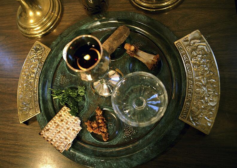 FILE - In this April 2, 2006, file photo, a traditional Passover seder plate is seen at Congregation Beth El in Tyler, Texas, on the first night of Passover. For some Jews this year, Passover Seder will connect the exodus story with today's global refugee crisis through special recitations and rituals _ and refugee guests from around the world. The foods on the plate are symbols, and help tell the story of the exodus of the Jewish people from Egypt as told in the old Testament of the Bible. (AP Photo/Dr. Scott M. Lieberman, File)