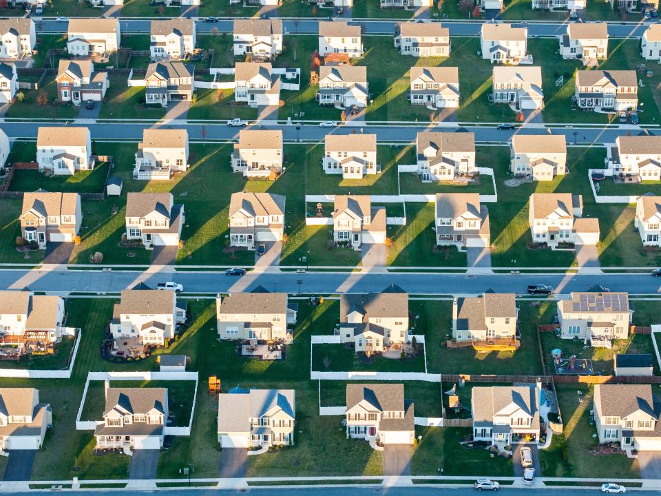 Aerial view of rows of suburban tract houses over Centerville, Maryland.