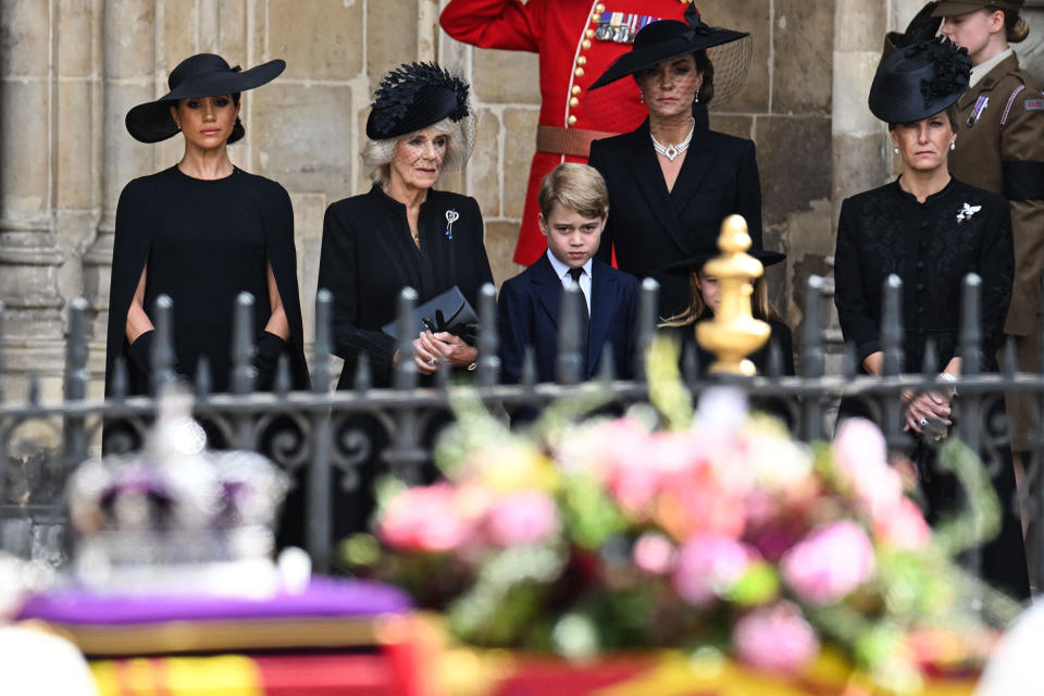 From left: Meghan Markle, Duchess of Sussex; Camilla, Queen Consort; Prince George of Wales; Catherine, Princess of Wales; and Sophie, Countess of Wessex look on Queen Elizabeth II's coffin leaves Westminster Abbey.<span class="copyright">Oli Scarff—Pool/AFP/Getty Images</span>