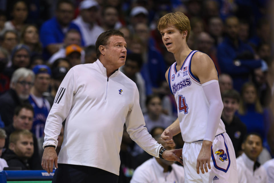 Kansas head coach Bill Self talks to Kansas guard Gradey Dick (4) during the second half of an NCAA college basketball game against Indiana in Lawrence, Kan., Saturday, Dec. 17, 2022. (AP Photo/Reed Hoffmann)