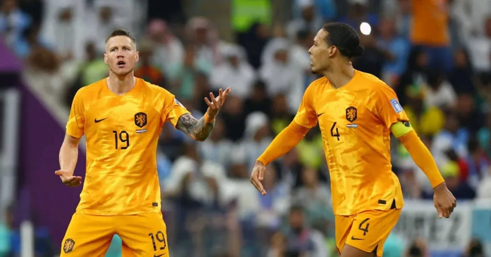 Netherlands internationals Wout Weghorst and Virgil van Dijk Credit: Alamy