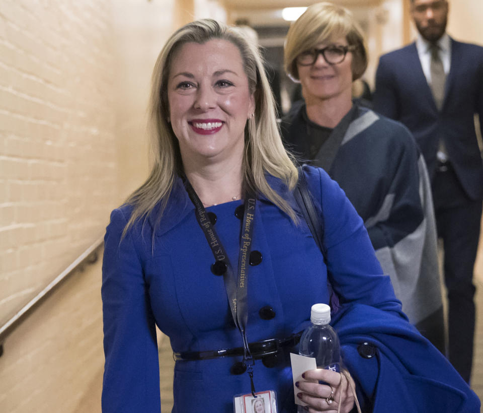 FILE - In this Nov. 15, 2018, file photo, then Rep.-elect Kendra Horn, D-Okla., walks through the basement of the Capitol in Washington. Horn is among the Democrats in swing districts who find themselves in a tight spot as the House opens an impeachment inquiry related to President Donald Trump's request for a foreign leader to dig up dirt on a political rival. (AP Photo/J. Scott Applewhite, File)