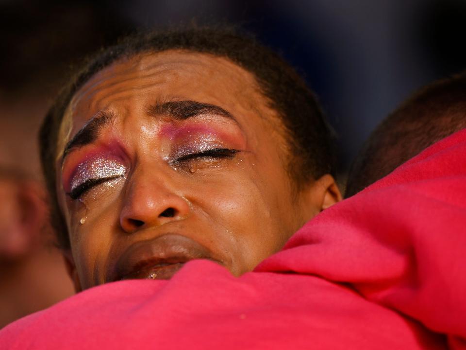 Leia-jhene Seals was performing at Club Q Saturday night when a 22-year-old gunman entered the LGBTQ nightclub, killing five people and injuring at least 25 others. Seals hugs R.J. Lewis at a vigil at All Souls Unitarian Church on November 20, 2022, in Colorado Springs, Colorado. Lewis was also at the nightclub.