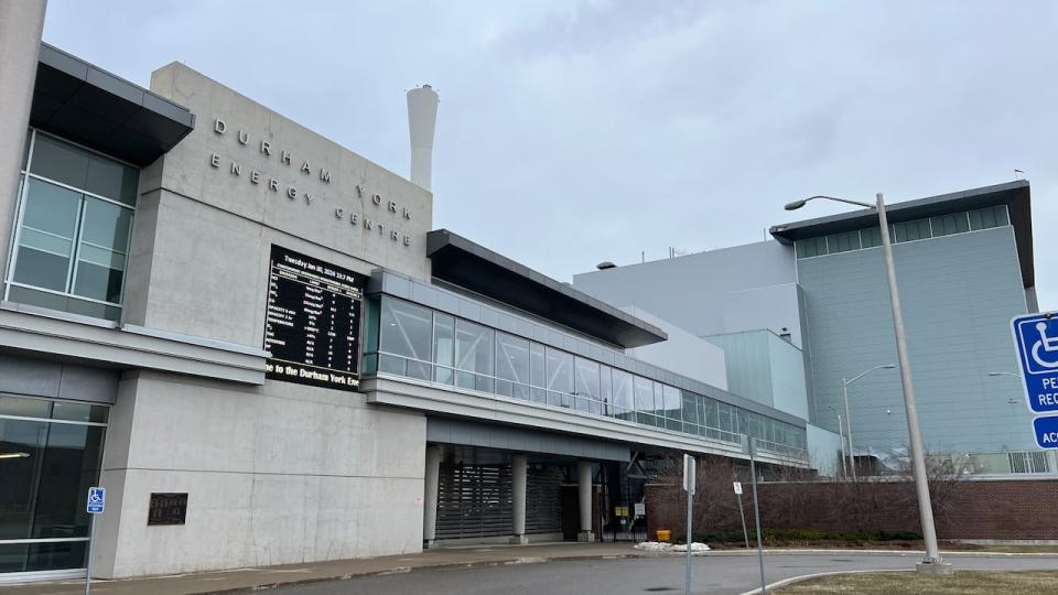 A large digital screen outside the Durham York Energy Centre displays the latest emissions readings alongside mandated standards.