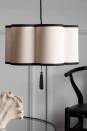 <p>A striking curved shape, silky outer shell, and black decorative detailing give this Rockett St George lampshade subtle Art Deco references. A great choice for a monochrome design scheme – the warm cream is a more forgiving shade than a stark white. </p><p><strong>Shop now: <a href="https://www.rockettstgeorge.co.uk/black-cream-lantern-curved-ceiling-light-shade.html" rel="nofollow noopener" target="_blank" data-ylk="slk:Black & Cream Curved Light Shade at Rockett St George;elm:context_link;itc:0;sec:content-canvas" class="link ">Black & Cream Curved Light Shade at Rockett St George</a></strong></p>