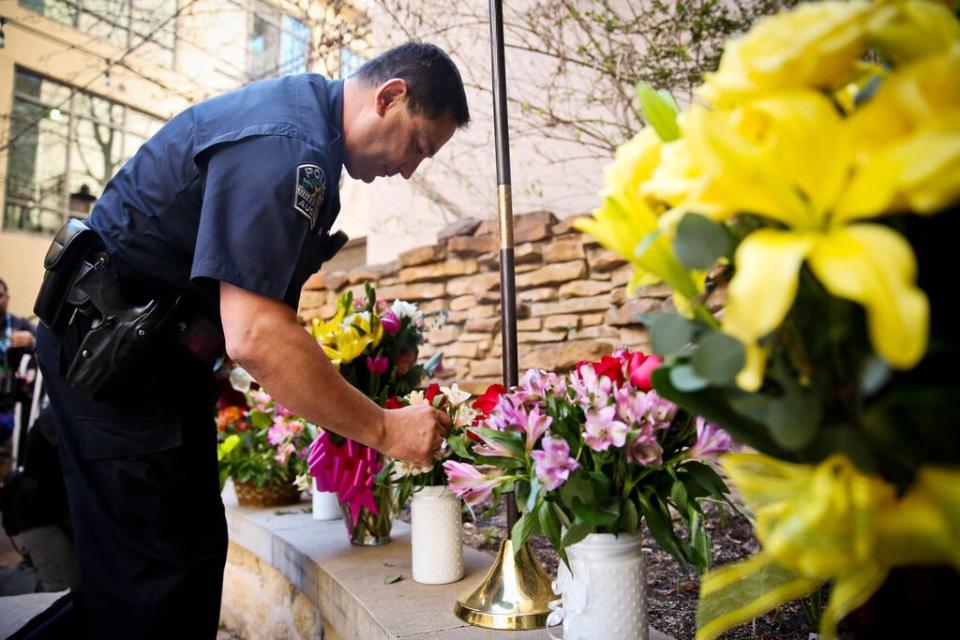 In this file photo, Austin Police Chief Art Acevedo takes a flower in memory of the victims of a suspected drunk driving accident during the SXSW event. A vigil was held at St. David's Episcopal Church on March 13, 2014 in Austin, Texas.