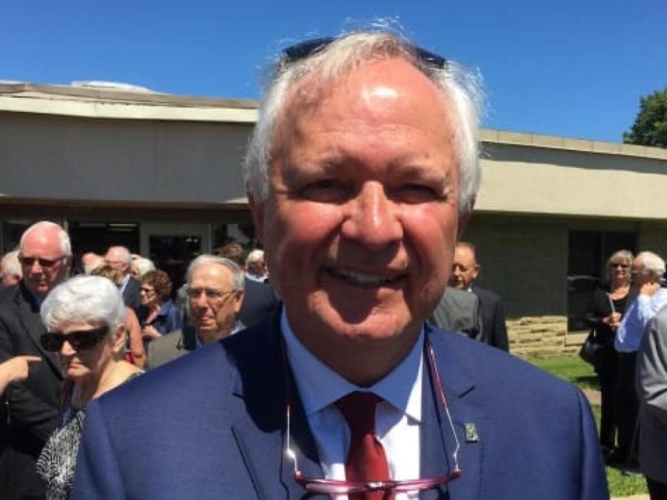 Former Liberal premier Camille Thériault says the commision will work with a figure of 11,714 for the average number of residents in each new riding. (CBC - image credit)