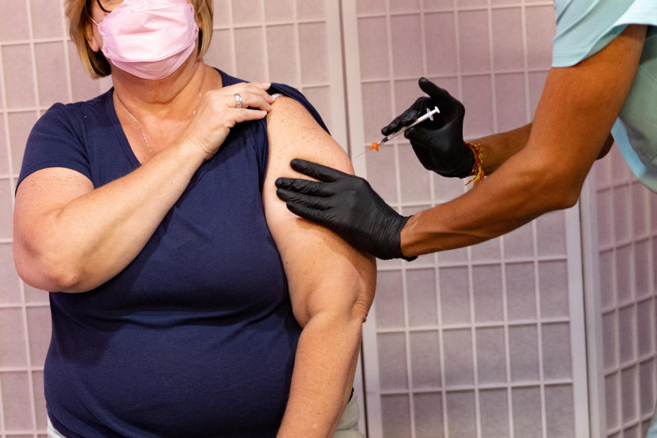 Oxford Biomedica  Colleen Dempsey, 54, receives the Pfizer-BioNTech coronavirus disease (COVID-19) booster vaccine targeting BA.4 and BA.5 Omicron sub variants at Skippack Pharmacy in Schwenksville, Pennsylvania, U.S., September 8, 2022.  REUTERS/Hannah Beier